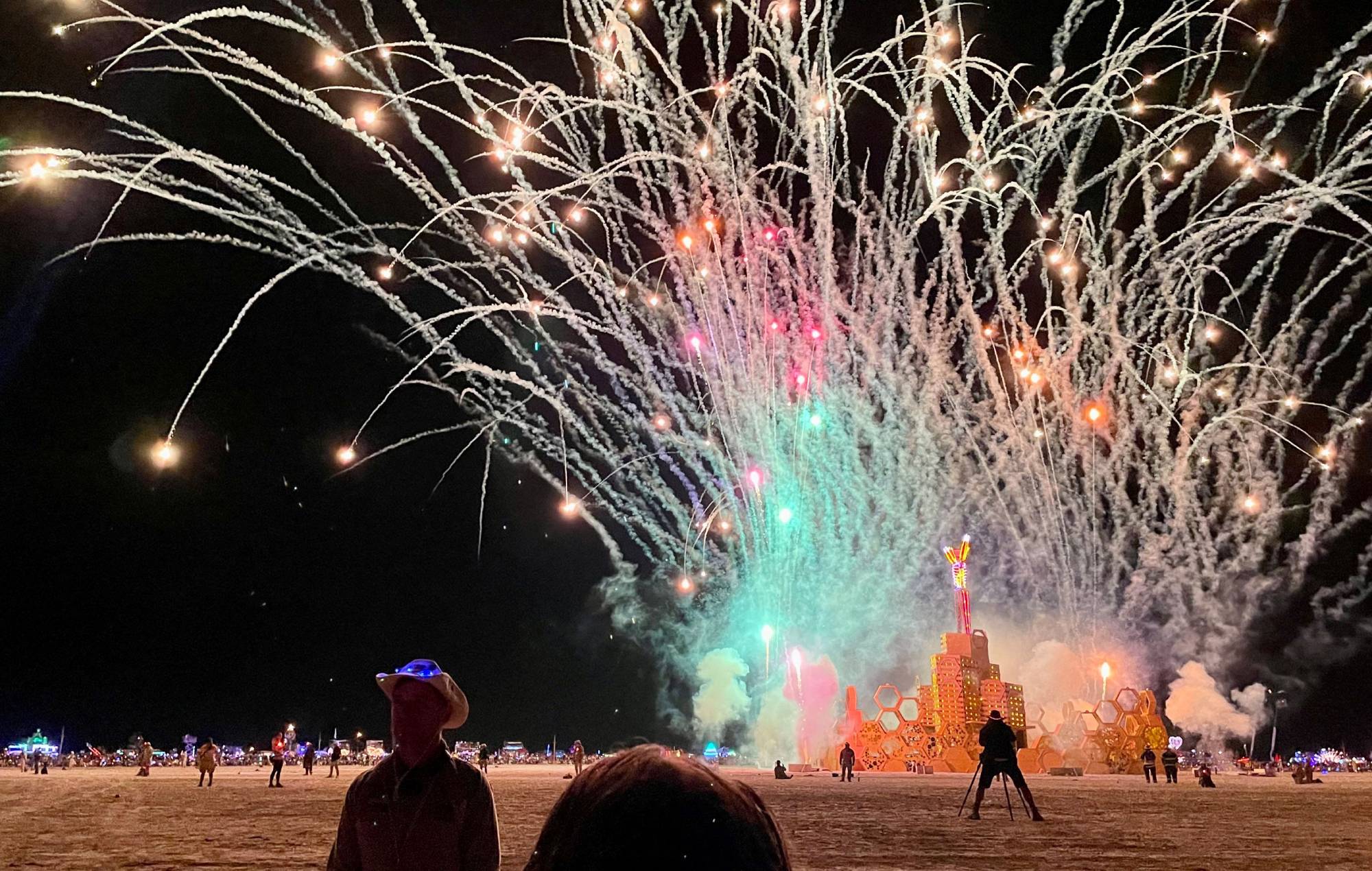 A security guard keeps people back during the annual Burning Man Festival on September 4, 2023. (Photo by JULIE JAMMOT/AFP via Getty Images)