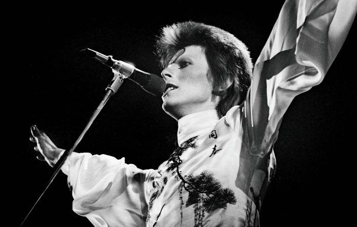 David Bowie performs live on stage at Earls Court Arena on May 12 1973 during the Ziggy Stardust tour. CREDIT: Gijsbert Hanekroot/Redferns