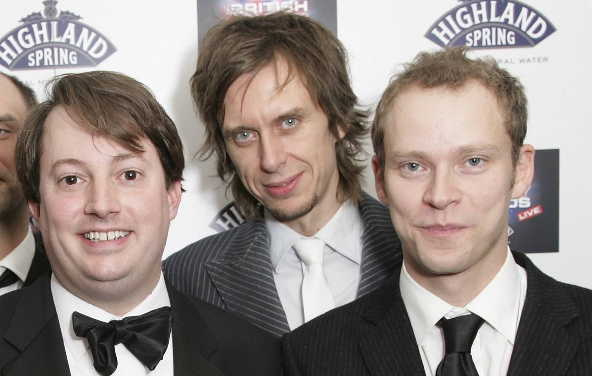 The cast and crew of Peep Show including actors Robert Webb (R), Matt King (2nd R) and David Mitchell (3rd R) pose in the awards room with the award for Best TV Comedy of 2006 at the British Comedy Awards 2006 at London Television Studios on December 13, 2006 in London, England. (Photo by Dave Hogan/Getty Images)